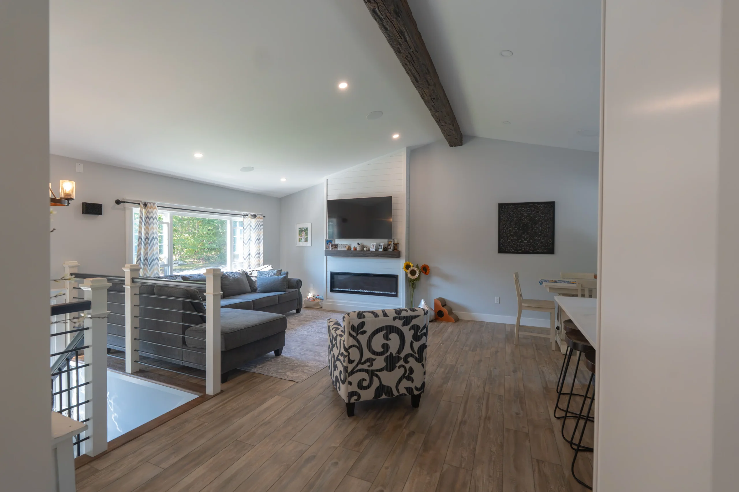 Rebuilt vaulted living room with shiplap fireplace wall - Lucy Lane after