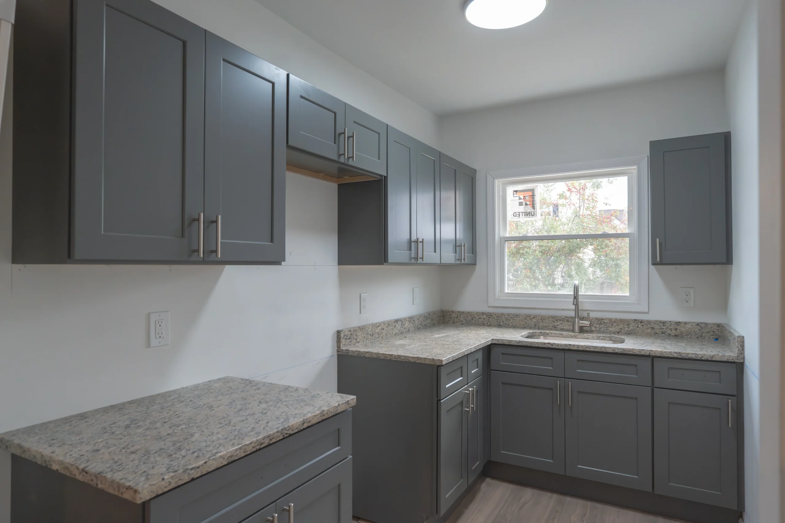 New gray shaker kitchen after full interior rebuild - Hemlock Street